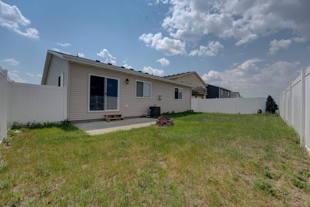 3328 NW 20th Ave, Minot, ND 58703 - back of house featuring a patio area and an outdoor fire pit