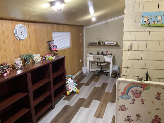 525 12th St, Minot, ND 58703 - miscellaneous room featuring wood finished floors, wood walls, and a desk