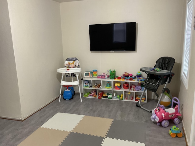 525 12th St, Minot, ND 58703 - playroom featuring wood finished floors and baseboards