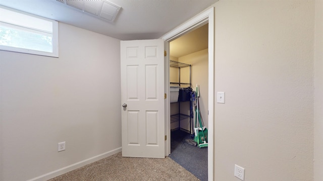 917 4th Ave, Minot, ND 58703 - hall featuring light carpet and baseboards