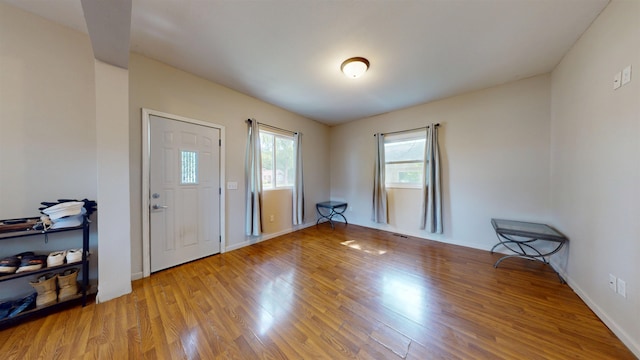 917 4th Ave, Minot, ND 58703 - entryway featuring wood finished floors and baseboards