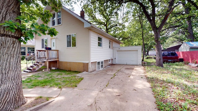 917 4th Ave, Minot, ND 58703 - view of side of property with a chimney and concrete driveway