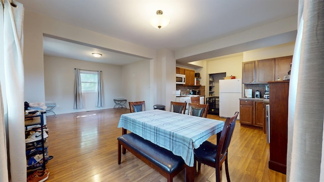 917 4th Ave, Minot, ND 58703 - dining room featuring light wood-type flooring