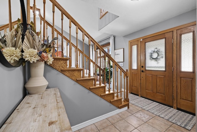 3304 12th St, Minot, ND 58701 - tiled foyer entrance with stairway and baseboards