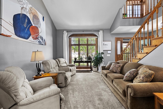 3304 12th St, Minot, ND 58701 - carpeted living room with stairs and high vaulted ceiling