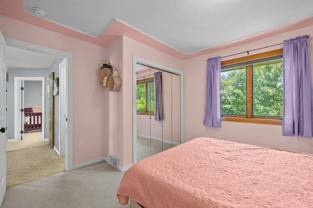 3304 12th St, Minot, ND 58701 - bedroom with carpet floors, baseboards, and a closet