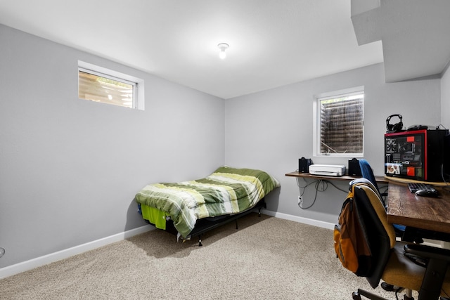 3304 12th St, Minot, ND 58701 - bedroom featuring carpet floors, baseboards, and multiple windows