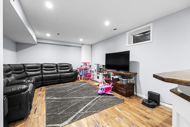 3304 12th St, Minot, ND 58701 - living room featuring wood finished floors, recessed lighting, and baseboards