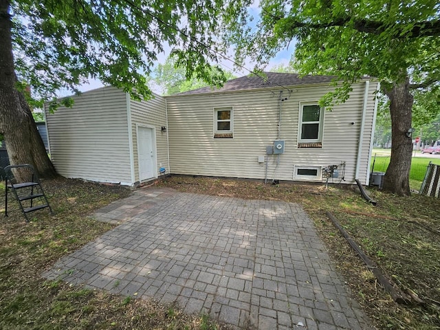 320 7th St, Minot, ND 58703 - back of property with a patio