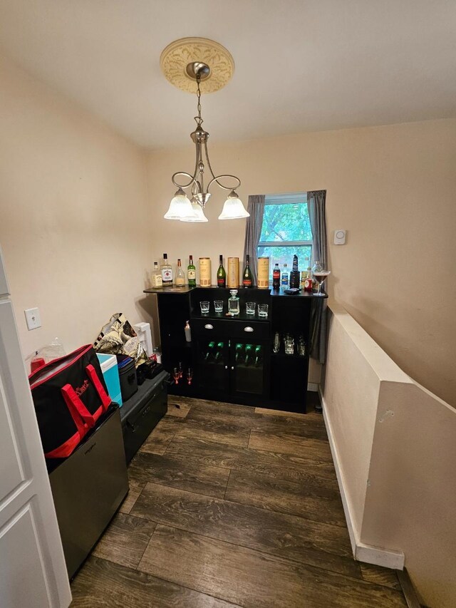 320 7th St, Minot, ND 58703 - dining area featuring wood finished floors and a chandelier