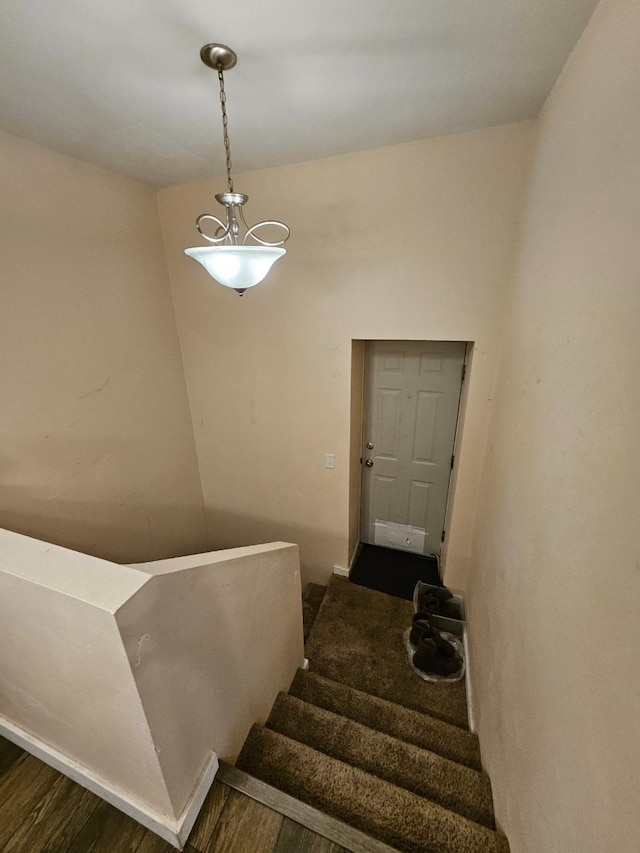 320 7th St, Minot, ND 58703 - stairway featuring wood finished floors