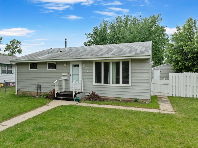 224 19th St, Minot, ND 58701 - view of front of house with roof with shingles