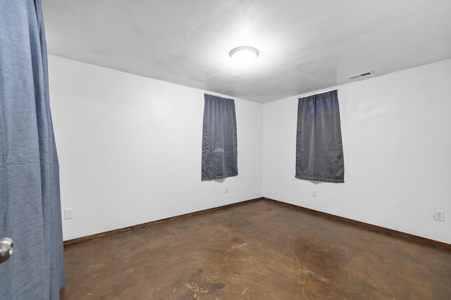 224 19th St, Minot, ND 58701 - unfurnished room with concrete floors and baseboards