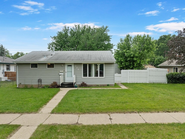 224 19th St, Minot, ND 58701 - ranch-style home with a shingled roof