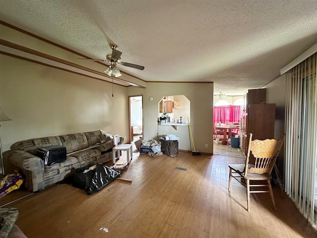 3622 4th Ave, Balfour, ND 58712 - living room featuring ceiling fan, plenty of natural light, light wood-style flooring, and a textured ceiling