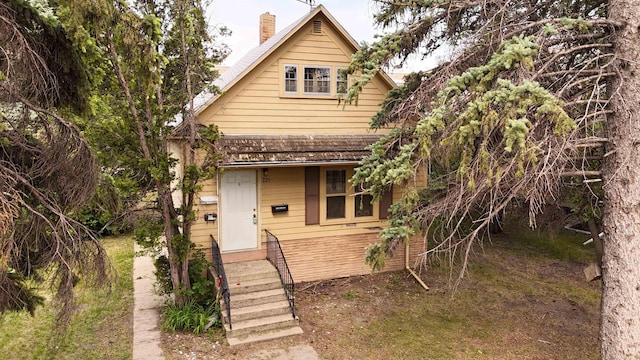 725 5th St, Minot, ND 58703 - view of front of house with a chimney