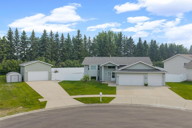 1705 SW Evergreen Ave, Minot, ND 58701 - split foyer home featuring a shed and a shingled roof