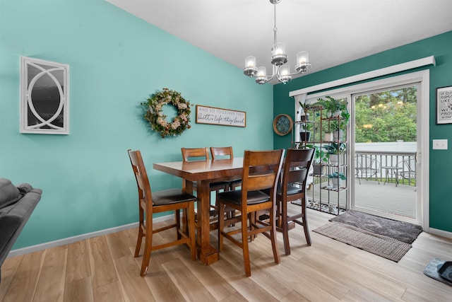 1705 SW Evergreen Ave, Minot, ND 58701 - dining area with a chandelier and light wood-style flooring