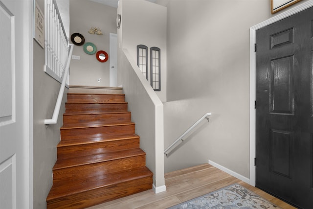 1705 SW Evergreen Ave, Minot, ND 58701 - stairway with wood finished floors and baseboards