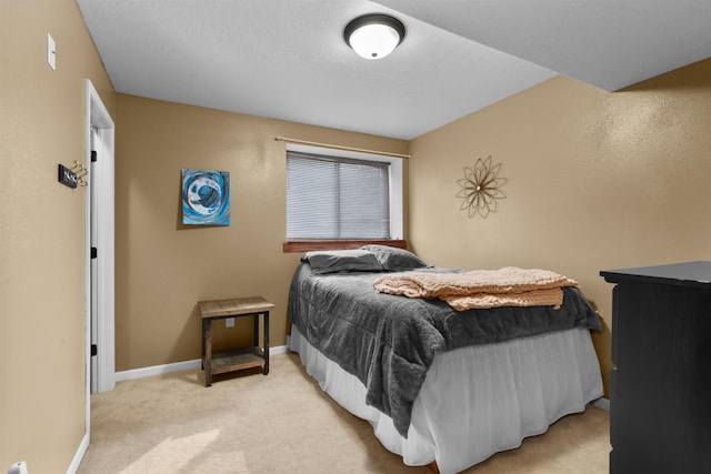 1705 SW Evergreen Ave, Minot, ND 58701 - bedroom featuring light colored carpet and baseboards