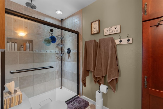 1705 SW Evergreen Ave, Minot, ND 58701 - full bathroom with a stall shower and baseboards