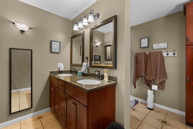 1705 SW Evergreen Ave, Minot, ND 58701 - bathroom with tile patterned flooring and double vanity