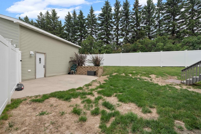 1705 SW Evergreen Ave, Minot, ND 58701 - fenced backyard with a patio and stairs