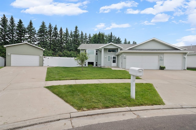 1705 SW Evergreen Ave, Minot, ND 58701 - view of front of house with driveway and a garage