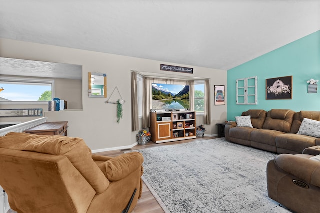 1705 SW Evergreen Ave, Minot, ND 58701 - living room with wood finished floors and vaulted ceiling