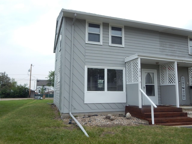 2014 4th St, Minot, ND 58703 - view of front of home with a front yard