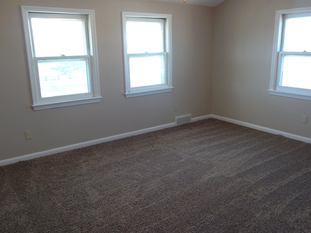 2014 4th St, Minot, ND 58703 - carpeted spare room with healthy amount of natural light