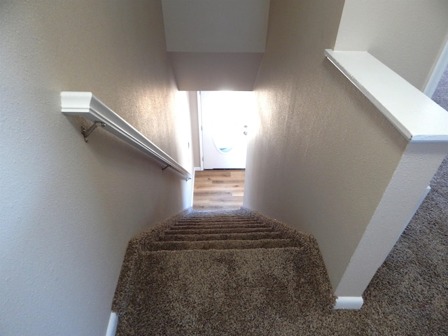 2014 4th St, Minot, ND 58703 - staircase featuring a textured wall