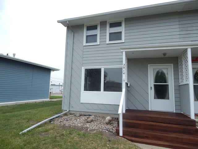 2014 4th St, Minot, ND 58703 - property entrance with a yard
