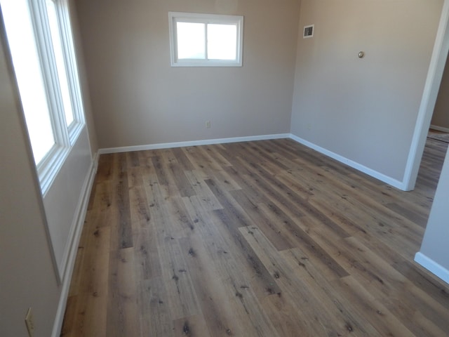 2014 4th St, Minot, ND 58703 - empty room featuring wood finished floors