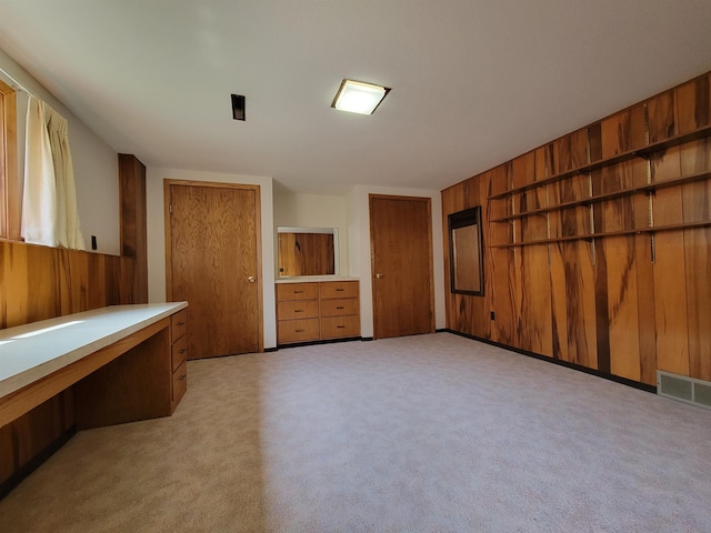 1000 21st St, Minot, ND 58703 - unfurnished bedroom featuring two closets
