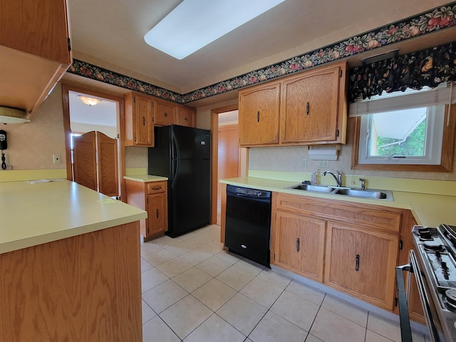 1000 21st St, Minot, ND 58703 - kitchen with black appliances, light tile patterned floors, and light countertops