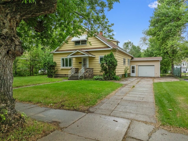 306 2nd St, Towner, ND 58788 - view of front of property featuring concrete driveway, an outdoor structure, and a front lawn