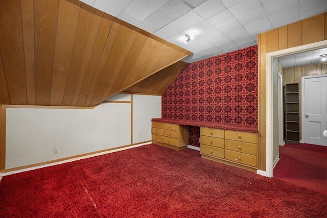 306 2nd St, Towner, ND 58788 - additional living space featuring carpet floors, wallpapered walls, lofted ceiling, and a desk
