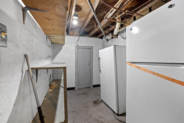 306 2nd St, Towner, ND 58788 - unfinished below grade area with freestanding refrigerator