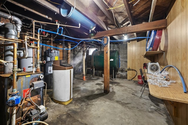 306 2nd St, Towner, ND 58788 - unfinished basement featuring oil tank, water heater, a heating unit, and wooden walls
