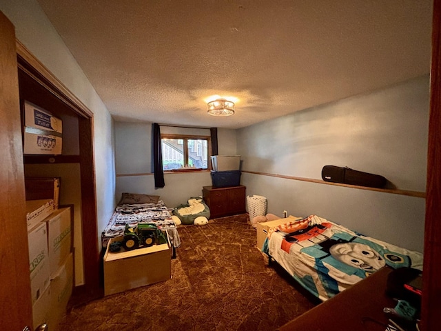3 30th St, Minot, ND 58701 - carpeted bedroom with a textured ceiling