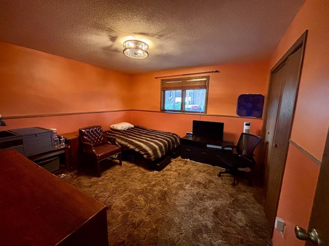 3 30th St, Minot, ND 58701 - carpeted bedroom with a textured ceiling and a desk
