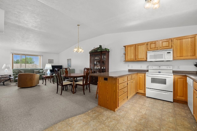 2009 14th St, Minot, ND 58703 - kitchen featuring white appliances, lofted ceiling, a peninsula, dark countertops, and open floor plan