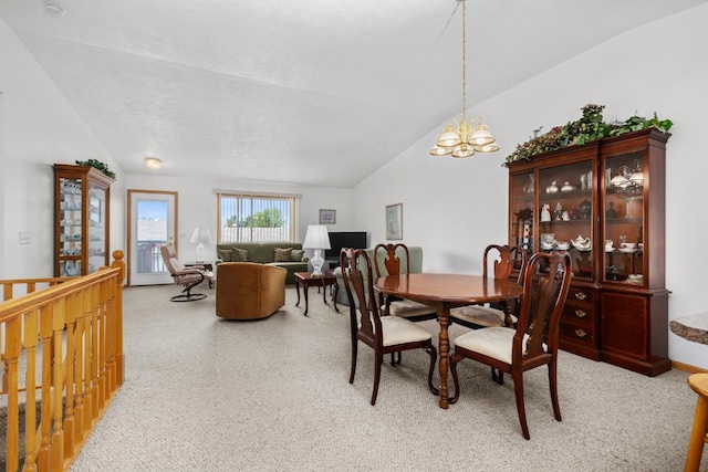 2009 14th St, Minot, ND 58703 - dining area featuring vaulted ceiling and a chandelier