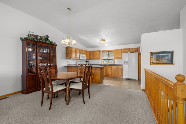2009 14th St, Minot, ND 58703 - dining space featuring lofted ceiling, a chandelier, and light carpet