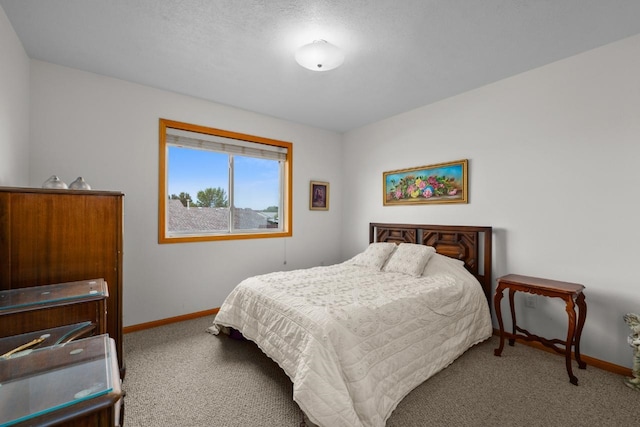 2009 14th St, Minot, ND 58703 - carpeted bedroom featuring baseboards