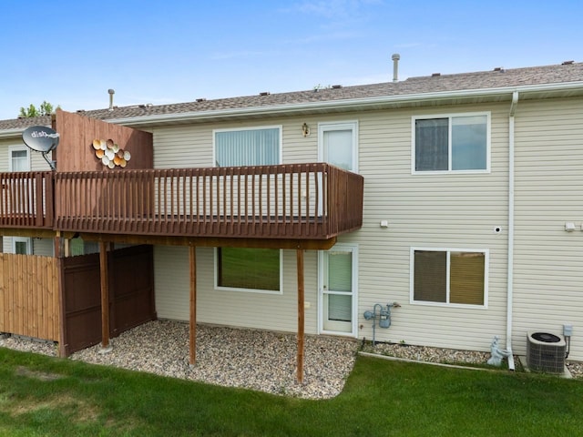 2009 14th St, Minot, ND 58703 - back of property with a wooden deck and a yard
