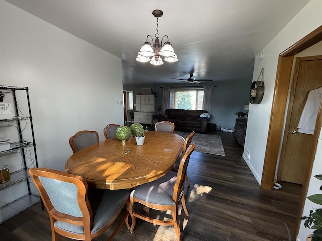3301 SE 1st St, Minot, ND 58701 - dining room featuring dark wood finished floors, a chandelier, and a ceiling fan