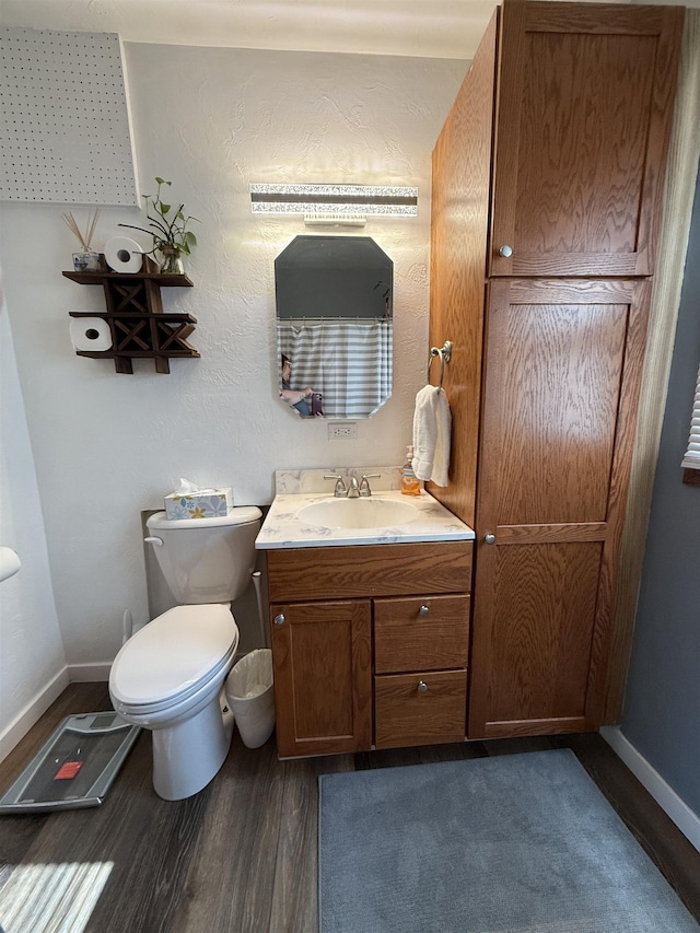 3301 SE 1st St, Minot, ND 58701 - bathroom featuring wood finished floors and vanity