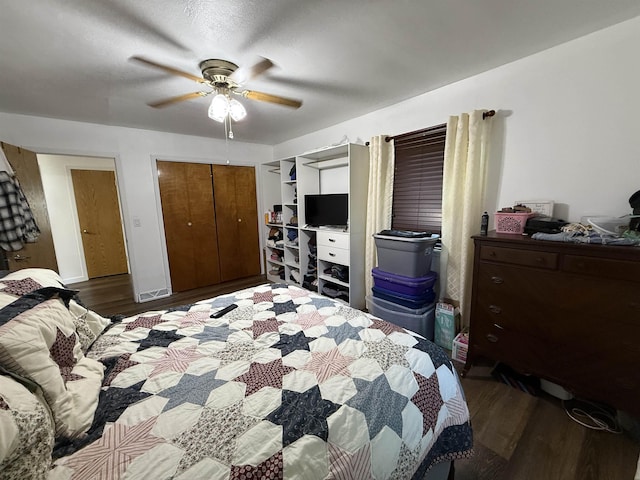 3301 SE 1st St, Minot, ND 58701 - bedroom with wood finished floors, a ceiling fan, and a closet